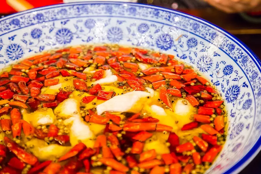 boiled fish slices in hot oil